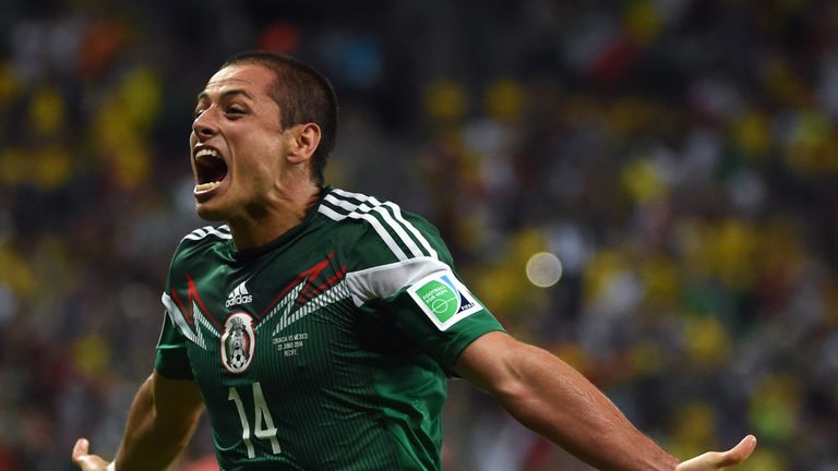 Javier Hernandez celebrates after his team scored during a Group A football match between Croatia and Mexico at the Pernambuco Arena