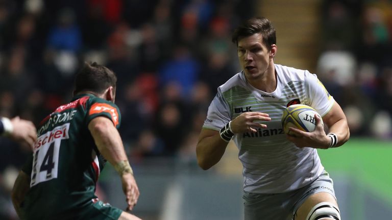 LEICESTER, ENGLAND - DECEMBER 24:  Michael Rhodes of Saracens takes on Adam Thompstone during the Aviva Premiership match between Leicester Tigers and Sara
