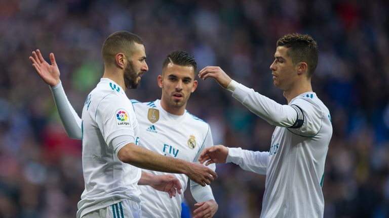 Karim Benzema celebrates with Cristiano Ronaldo after scoring from the penalty spot