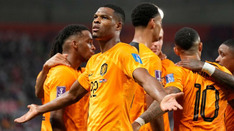 Denzel Dumfries celebrates after scoring Netherlands' third goal against USA