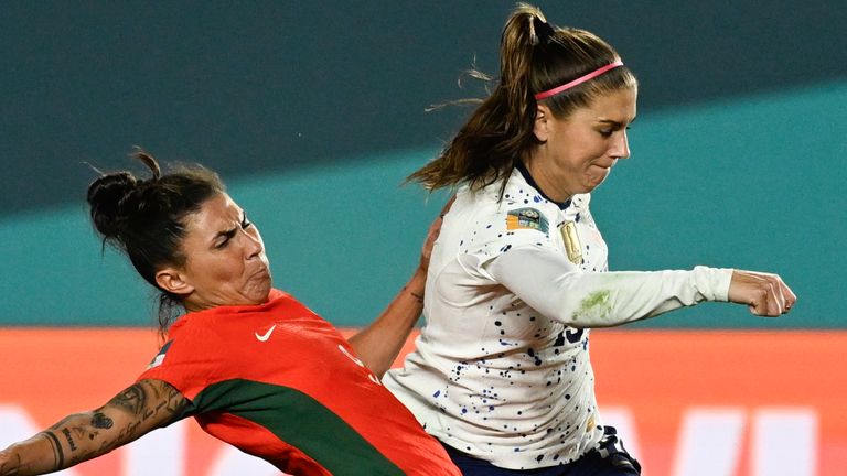 United States' Alex Morgan, right, attempts a shot as Portugal's Ana Borges blocks during the Women's World Cup Group E soccer match between Portugal and the United States at Eden Park in Auckland, New Zealand, Tuesday, Aug. 1, 2023. (AP Photo/Andrew Cornaga)