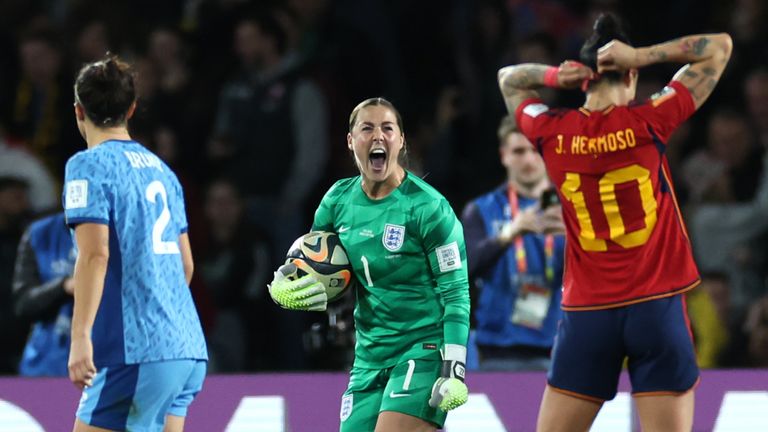 Mary Earps celebrates after saving Jennifer Hermoso's penalty