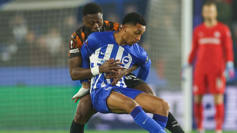 Joao Pedro is challenged by Chancel Mbemba