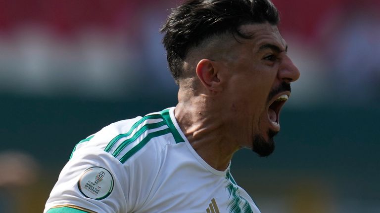 Algeria's Baghdad Bounedjah celebrates after scoring his side's opening goal during the African Cup of Nations Group D soccer match between Algeria and Burkina Faso at the Peace of Bouake stadium in Bouake, Ivory Coast, Saturday, Jan. 20, 2024. (AP Photo/Themba Hadebe)