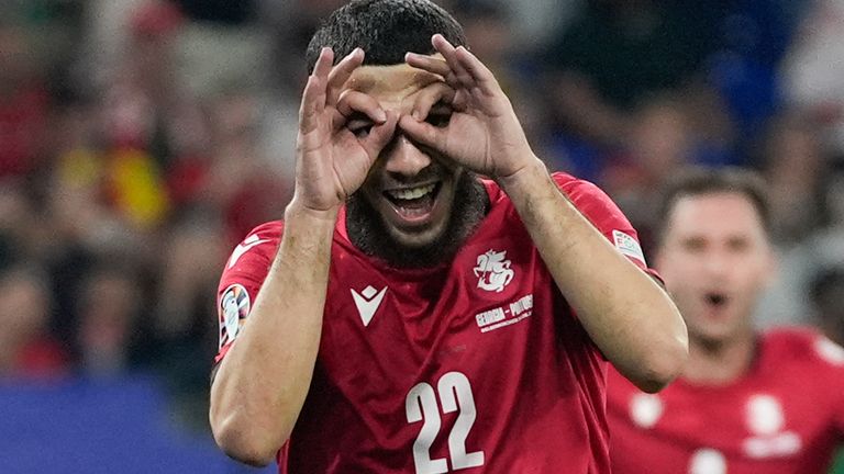 Georgia's Georges Mikautadze celebrates after scoring on a penalty kick during a Group F match between Georgia and Portugal at the Euro 2024 soccer tournament in Gelsenkirchen, Germany, Wednesday, June 26, 2024. (AP Photo/Martin Meissner)