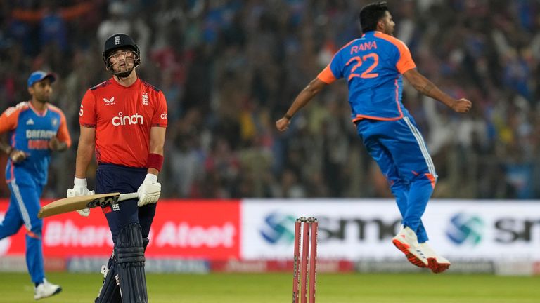 England's Liam Livingstone, center, reacts after losing his wicket to India's Harshit Rana, right, during the fourth T20 cricket match between England and India in Pune, India, Friday, Jan. 31, 2025. (AP Photo/Rafiq Maqbool)