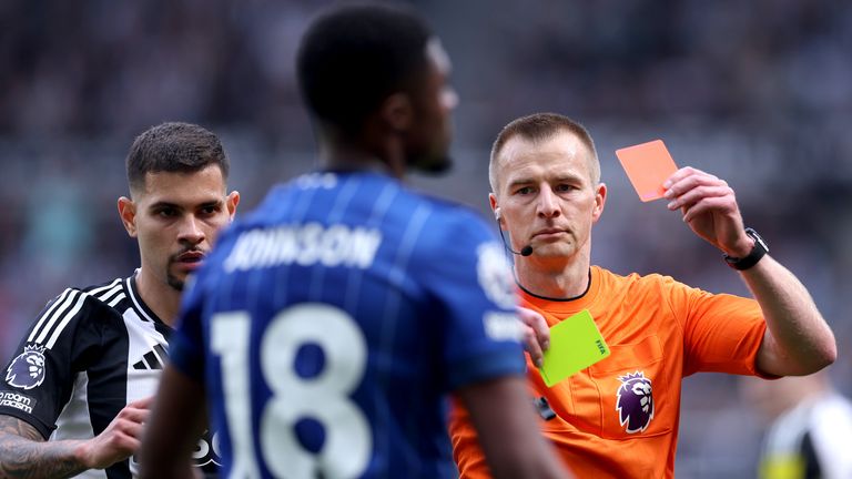 Ben Johnson is sent off by referee Michael Salisbury for a second bookable offence