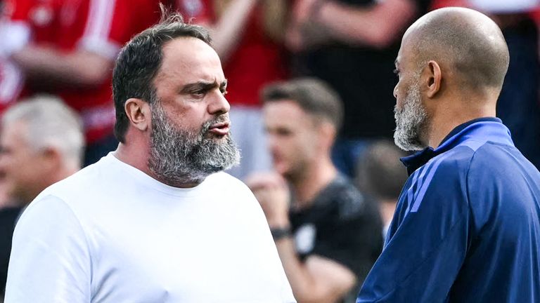 Nottingham Forest's Portuguese manager Nuno Espirito Santo (R) speaks with Nottingham Forest's Greek co-owner Evangelos Marinakis (L)