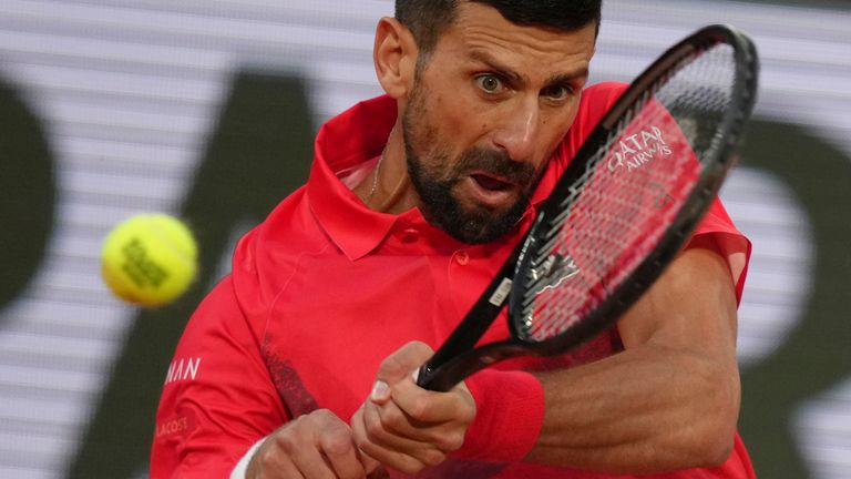 Serbia's Novak Djokovic plays a shot against Germany's Alexander Zverev during their quarterfinal match of the French Tennis Open at the Roland-Garros stadium in Paris, Wednesday, June 4, 2025. (AP Photo/Aurelien Morissard)