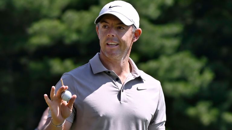 Rory McIlroy of Northern Ireland, waves as he is announced at the first tee during the first round of the Travelers Championship golf tournament at TPC River Highlands, Thursday, June 19, 2025, in Cromwell, Conn. (AP Photo/Jessica Hill)
